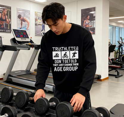 "Triathletes Don’t Get Old – They Change Age Groups" Humor Crewneck Sweatshirt